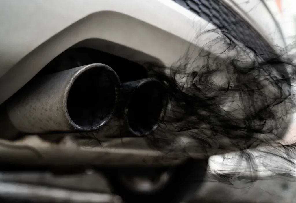 Car exhaust emitting dark smoke