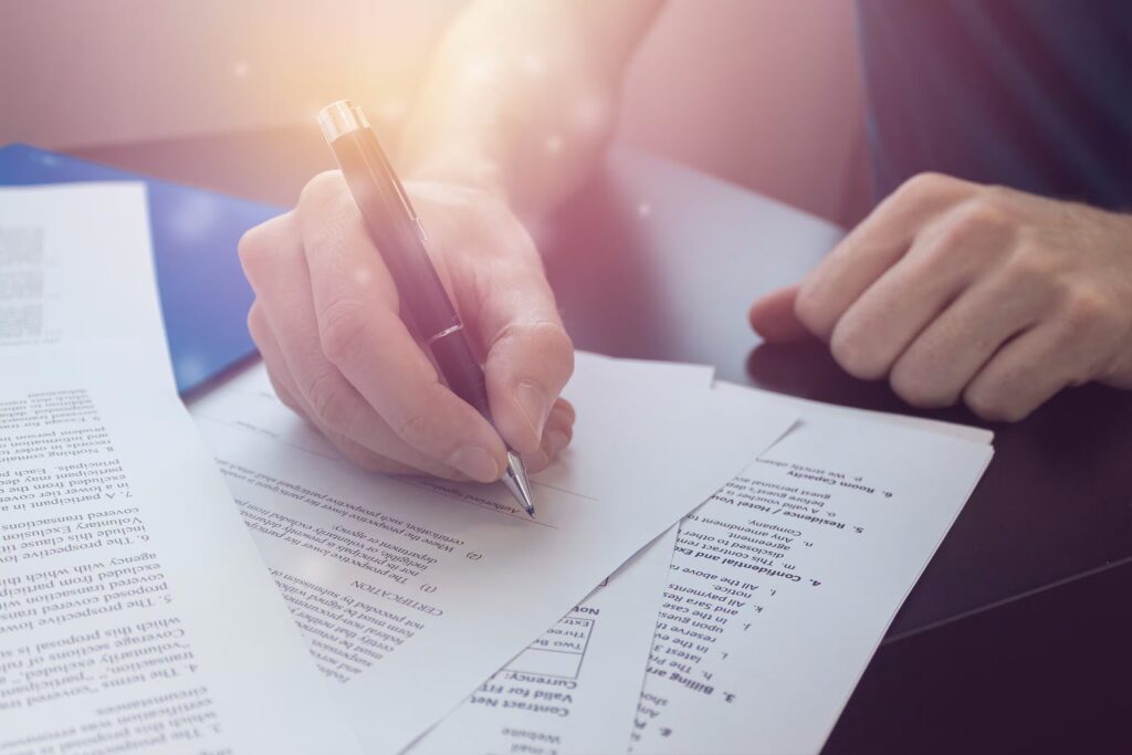 Person vin check documents with pen